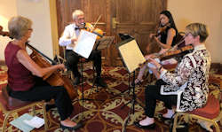 SMO quartet (Helen, Thelma, Nelson and Abi) playing at the Ball for the Alex Hulme Foundation Charity, July 2018